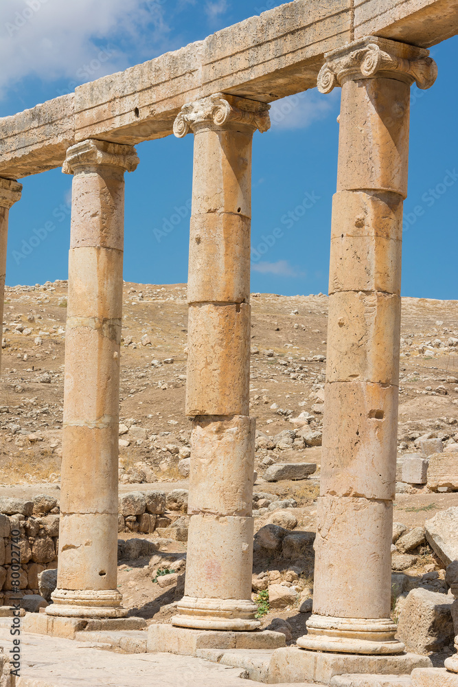 Semi-circle of columns forming a plaza at the ancient ruins of J