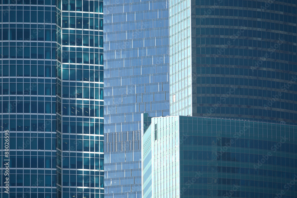 Skyscrapers in modern office business cluster. Close up view