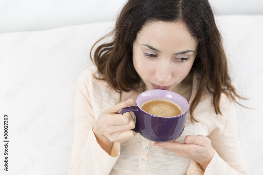 Beautiful woman drinking a cup of coffee Beautiful woman drinking a cup of coffee