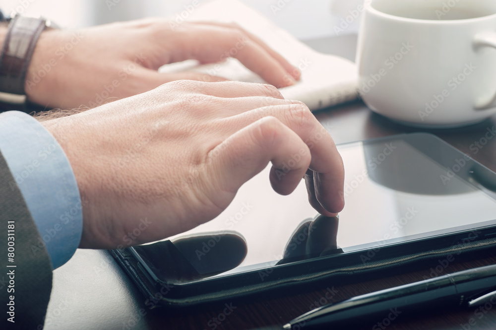 Businessman using a tablet device