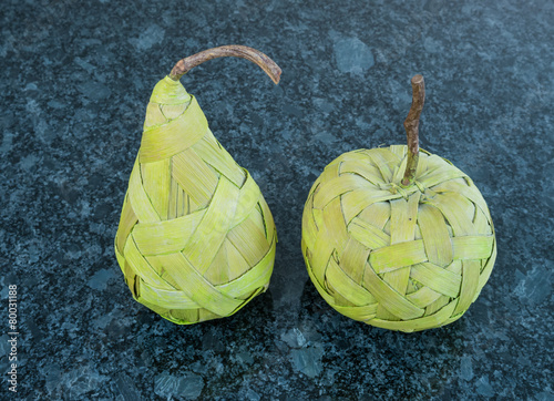 Fruits made from bast on the dark granite photo