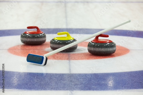 Valokuvatapetti Curling rocks on ice
