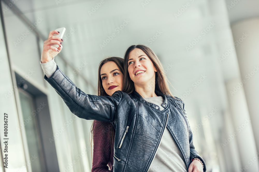 Happy girls taking a Selfie. Selective focus
