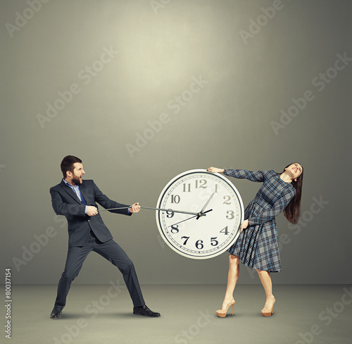 couple stretching out the clock and screaming photo