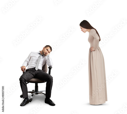woman looking at tired man