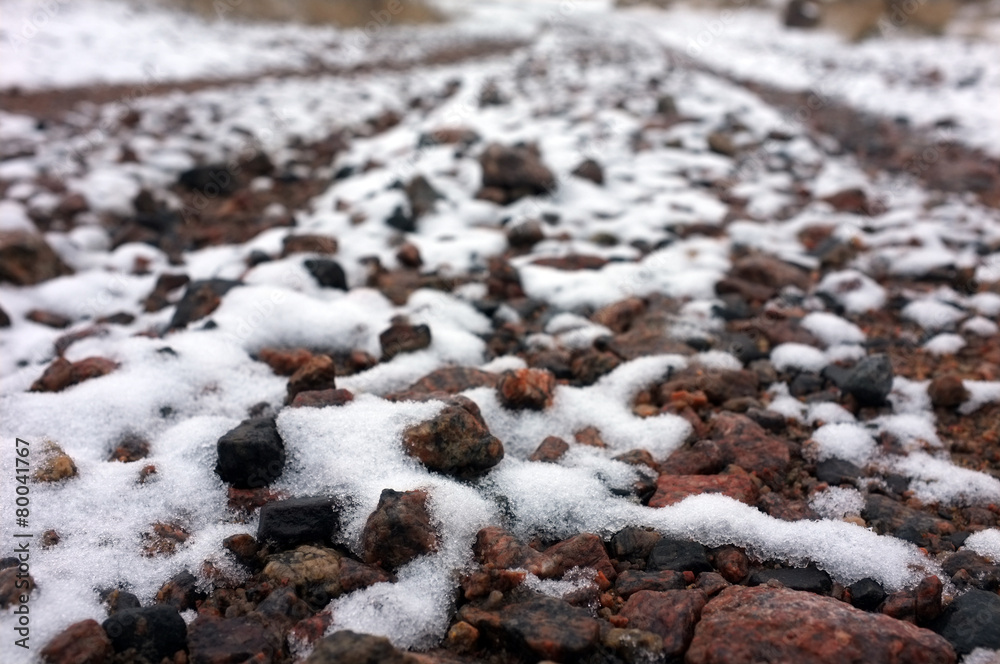 Many stones covered with snow