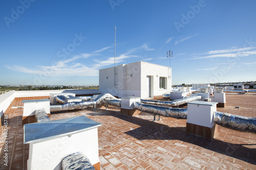 View on the roof of a building of a large air conditioning equip © juananbarros