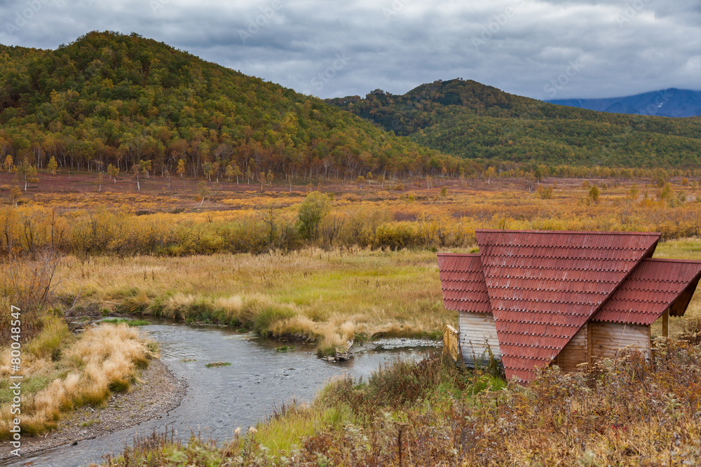 Mountain valley Stream and Automn meadow Hunters home.
