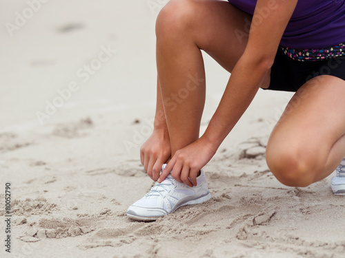 Lacing up before running © Sergey Nivens