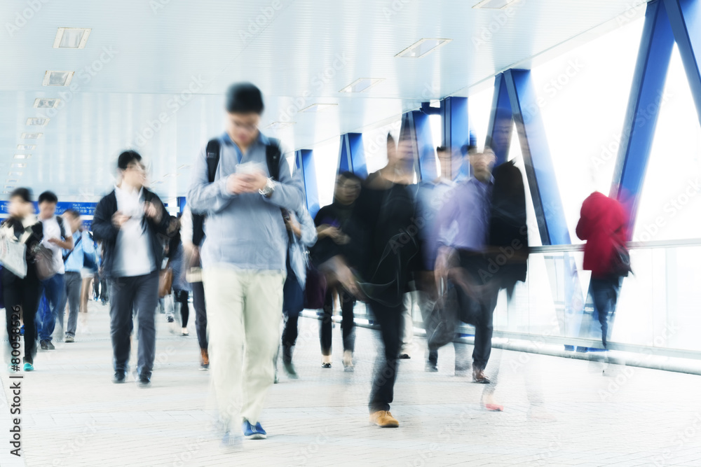 Fototapeta premium Motion blurred commuters in Hong Kong