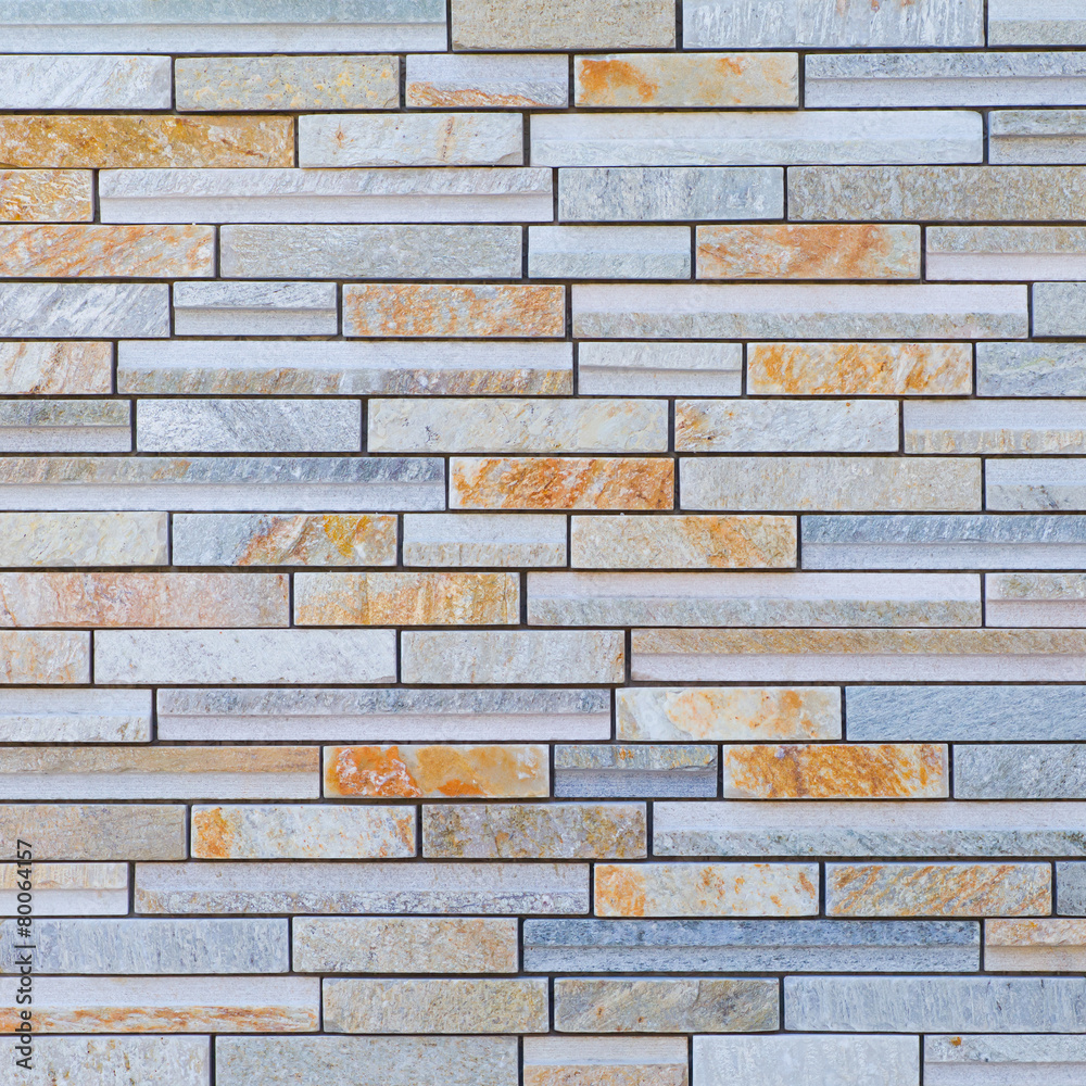 Fototapeta premium Texture and background of brown granite stone block wall