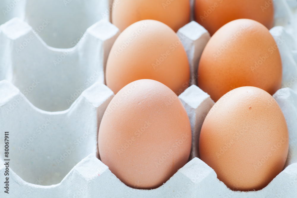 Healthy food brown chicken egg in carton container Healthy food brown chicken egg in carton container