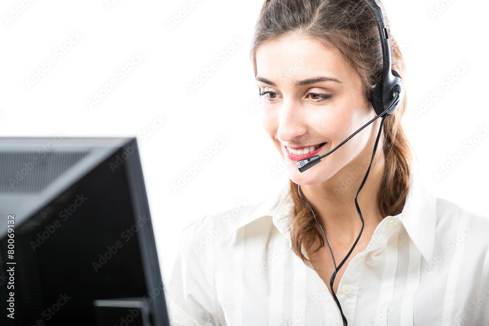 Working in headset in front of computer Working in headset in front of computer