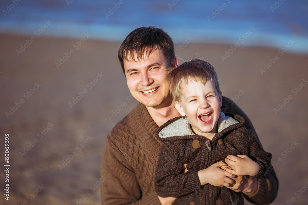 Fototapeta premium The dad is embracing his little son