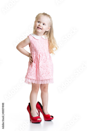 Toddler girl wearing big shoes