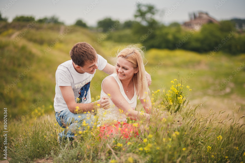 beautiful young couple in a field beautiful young couple in a field
