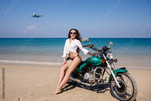 Young, sexual, the girl on the motorcycle, the flying plane, on