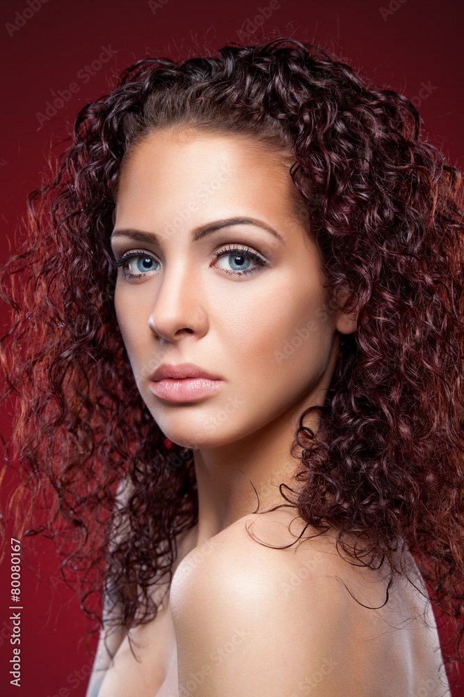 Beautiful  woman with red curly hair