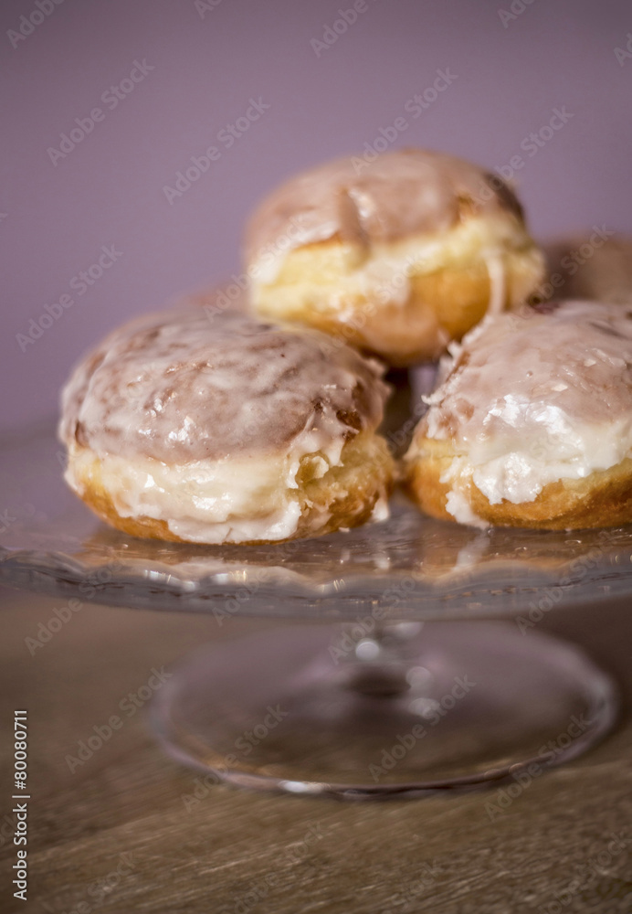 donuts lying on a decorative plate donuts lying on a decorative plate
