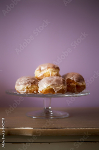 donuts lying on a decorative plate photo