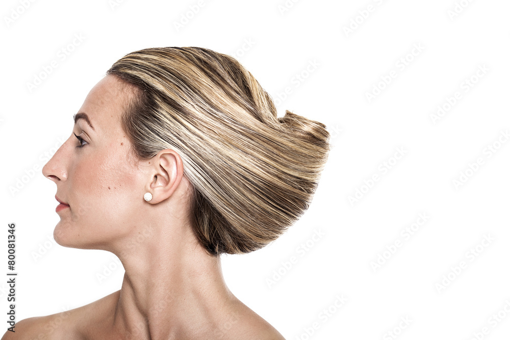 Pretty girl with banana hair bun profile portrait Pretty girl with banana hair bun profile portrait