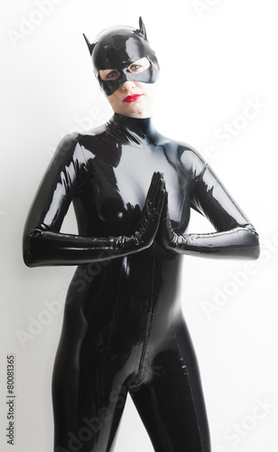 portrait of standing woman wearing latex clothes