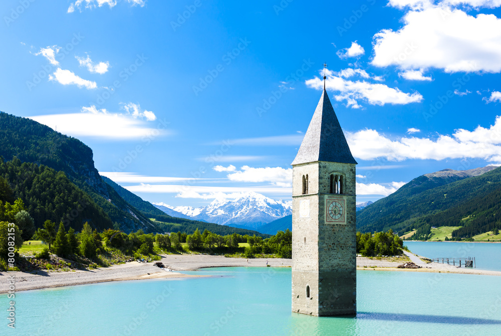 tower of sunken church in Resia lake, South Tyrol, Italy