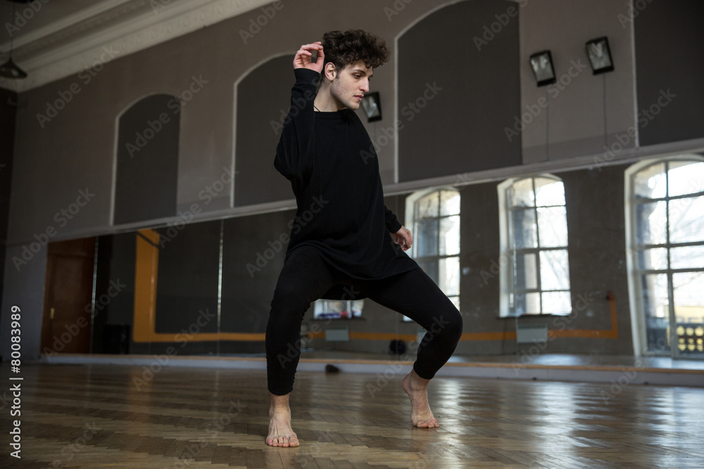 Fototapeta premium Handsome man dancing at gym