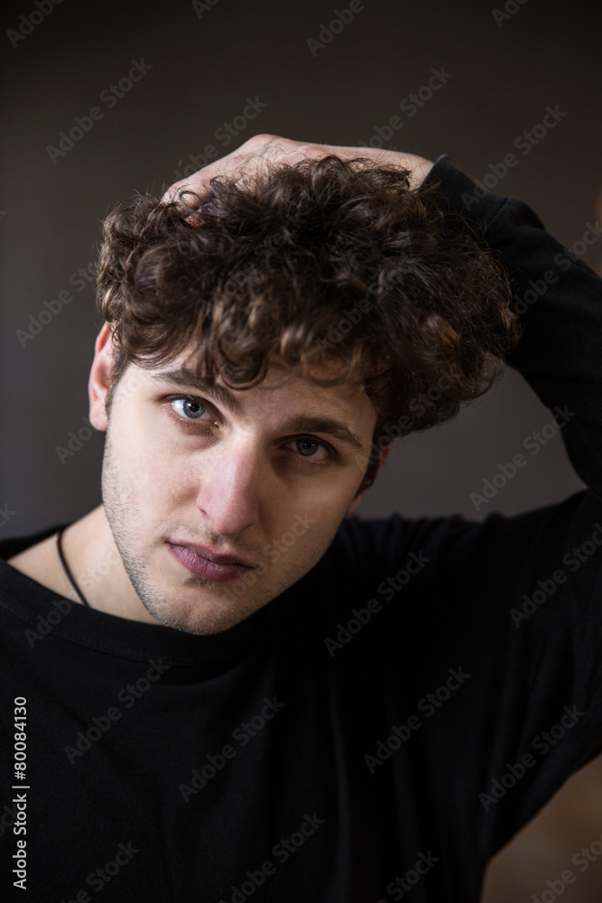 Fototapeta premium Young handsome man looking at camera