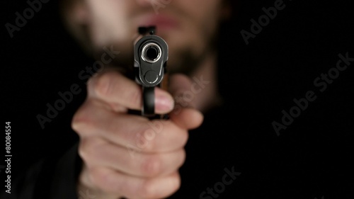 Real gunshot on black background photo