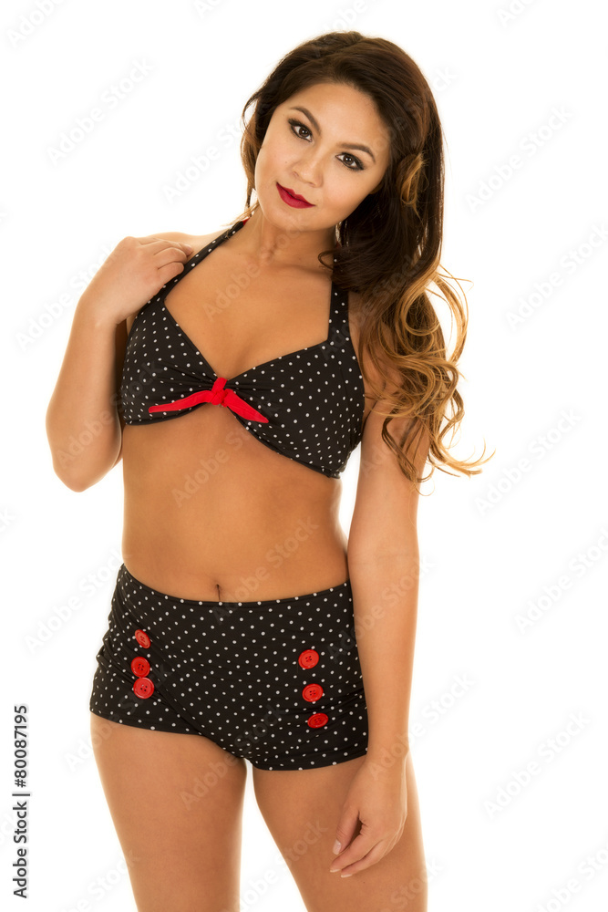 Fototapeta premium woman in vintage bikini stand hand on shoulder looking