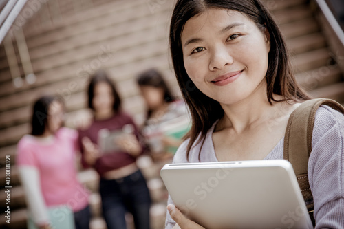 group of happy teen high school students outdoors