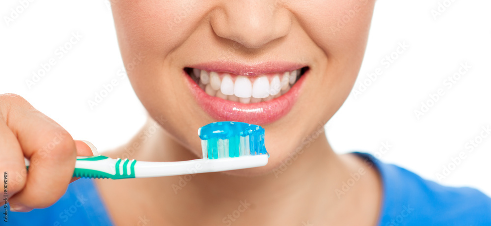 Healthy teeth and breath concept. Happy woman cleaning her teeth Healthy teeth and breath concept. Happy woman cleaning her teeth