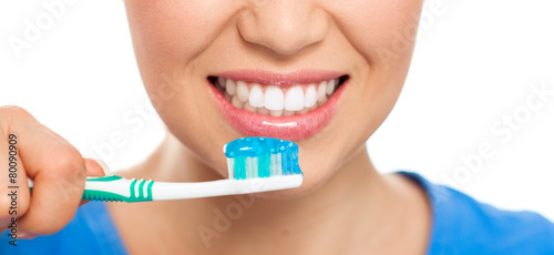 Healthy teeth and breath concept. Happy woman cleaning her teeth