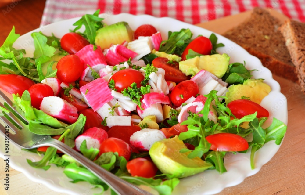 Mixed vegetable salad with crab sticks and avocado Mixed vegetable salad with crab sticks and avocado