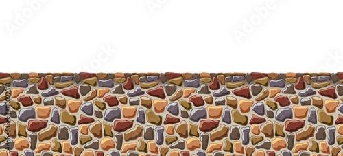 Seamless wall of rough stone.