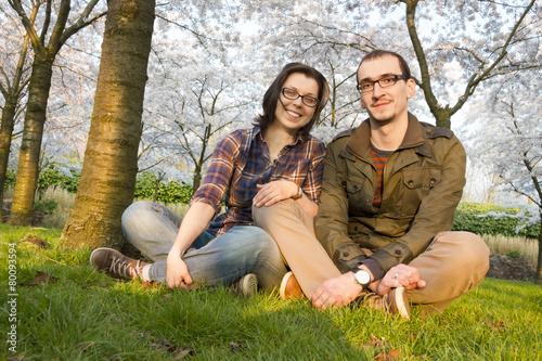 Young couple under the cherry trees