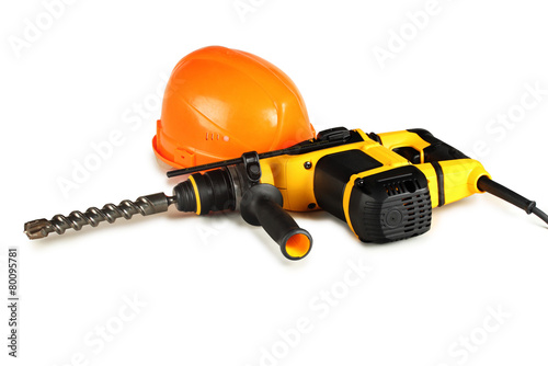 professional rotary hammer drill and a construction helmet