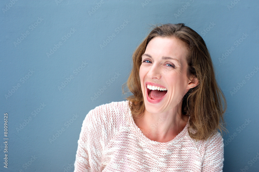 Happy beautiful fresh mid adult woman laughing - obrazy, fototapety, plakaty 