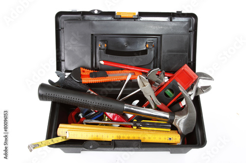 Tools in toolbox on plain background