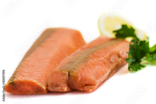 Raw salmon fillet with lemon and parsley isolated on white