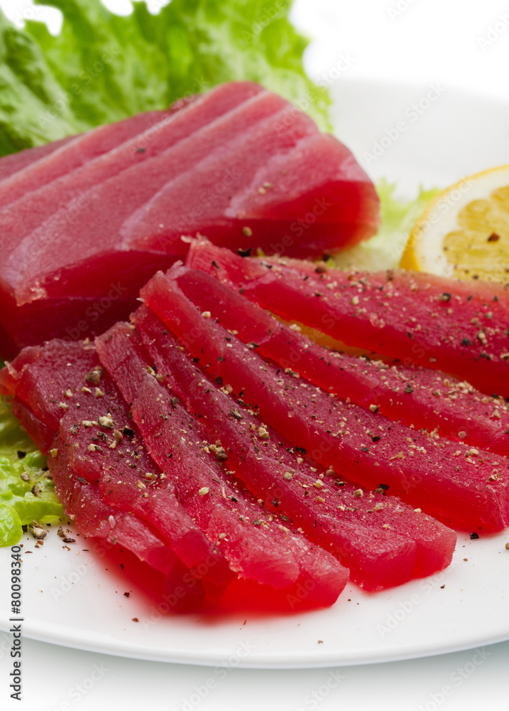 Slices of raw bluefin tuna  sashimi on white dish