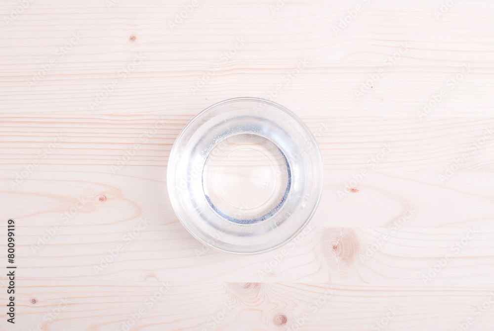 water in a glass and a napkin on the board water in a glass and a napkin on the board