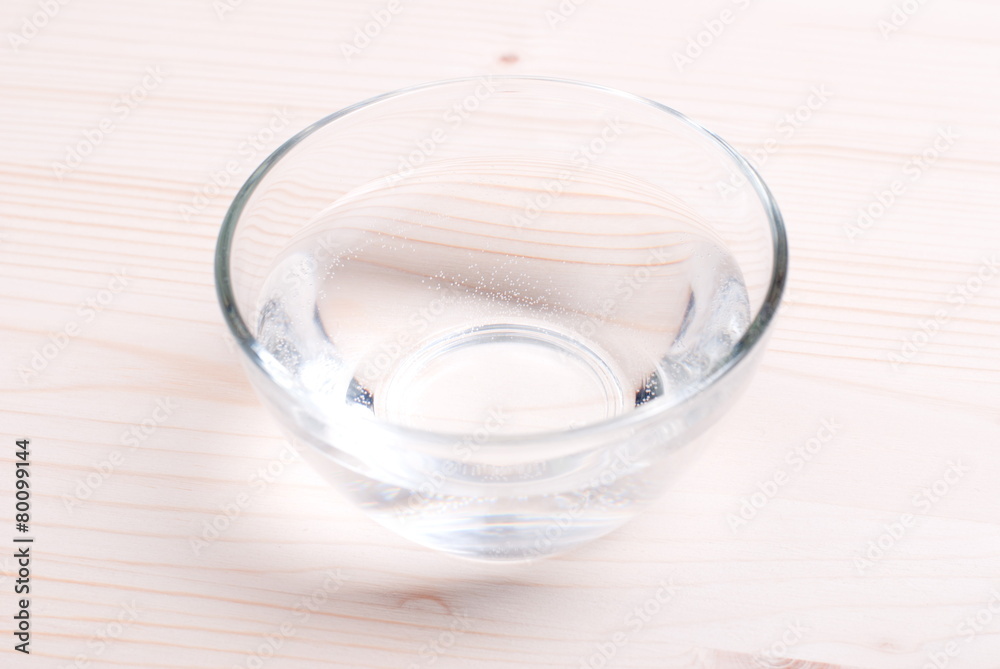water in a glass and a napkin on the board water in a glass and a napkin on the board