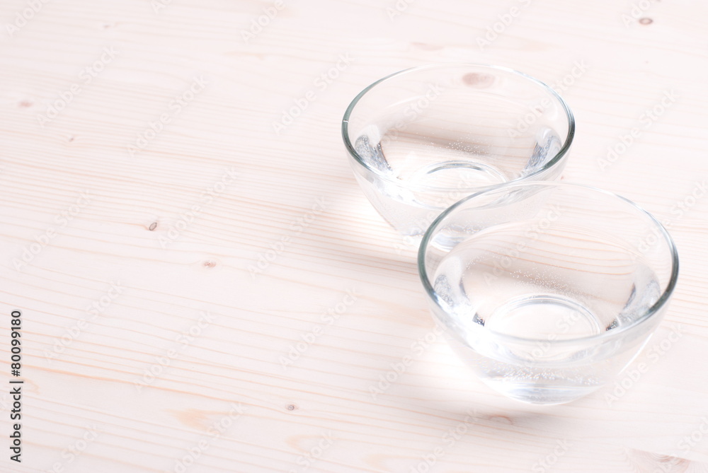 water in a glass and a napkin on the board water in a glass and a napkin on the board