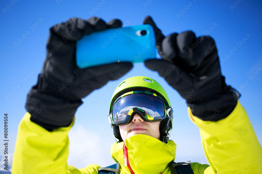 Man in winter clothes taking a selfie Man in winter clothes taking a selfie