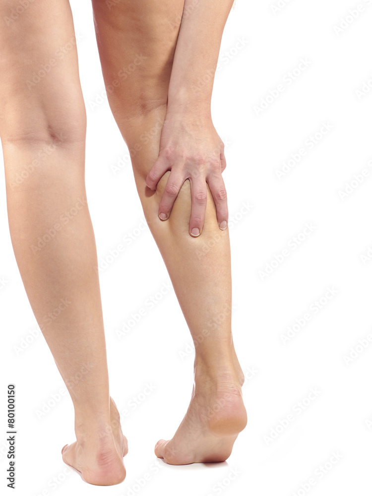 Woman massaging her painful leg calf. Woman massaging her painful leg calf.