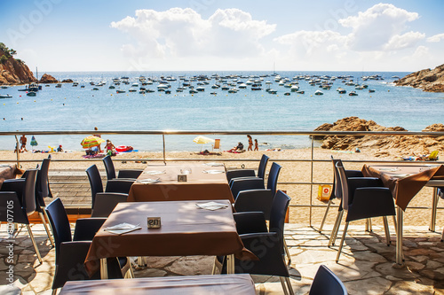 Tables at beach restaurant in Tamariu  Costa Brava  Spain