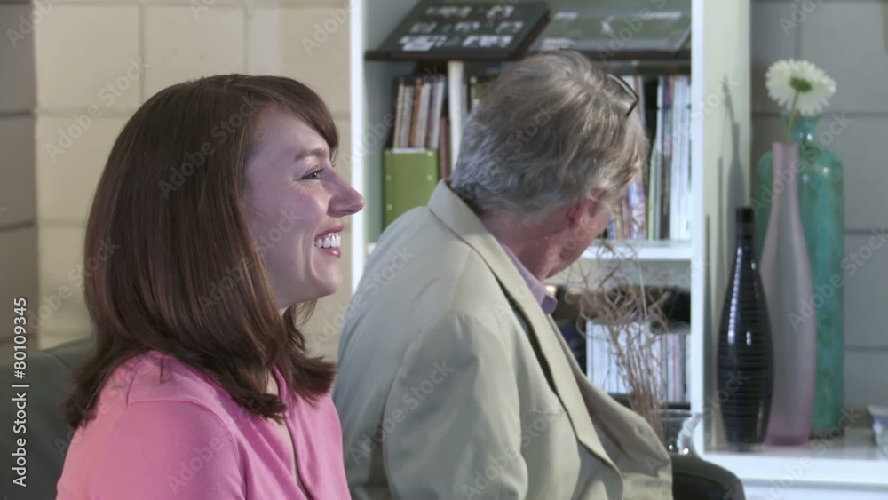 Young woman waits in an office reception and talks to an older man. Close up. Young woman waits in an office reception and talks to an older man. Close up.