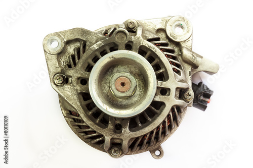 Dirty and Old Automotive alternator, Closeup on white background photo